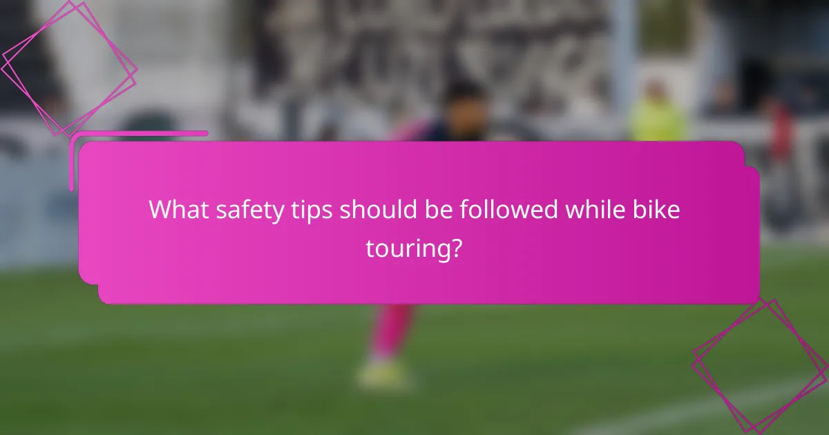 What safety tips should be followed while bike touring?